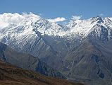 Mustang 03 02-5 Thorung Peak From Gya La Between Tetang And Muktinath Thorung Peak (6144m) is the nice snow mountain on the left, just to the south of the Thorung La, seen just past the Gya La (3970m) between Tetang and Muktinath. The trail from Tetang descends from the Gya La (3970m) and eventually joins the main trail from Manang to Ranipauwa. Muktinath is visible in the lower right.